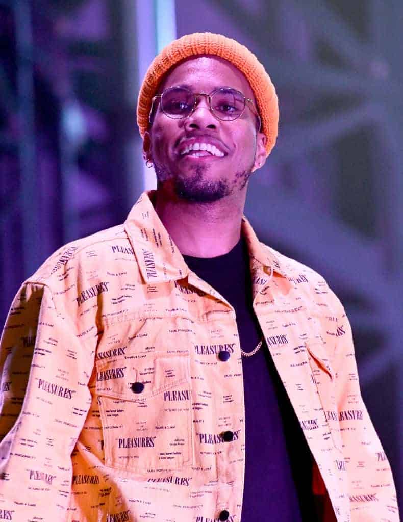 Anderson.Paak wearing all orange on stage