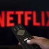 Netflix logo and a television remote.